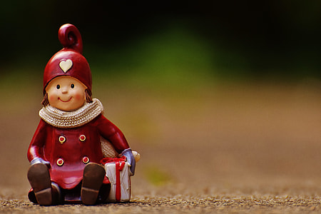 boy holding box figurine thumbnail