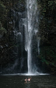 three people near water falls thumbnail