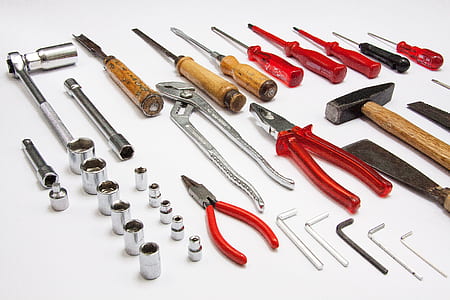 assorted hand tools on white surface thumbnail