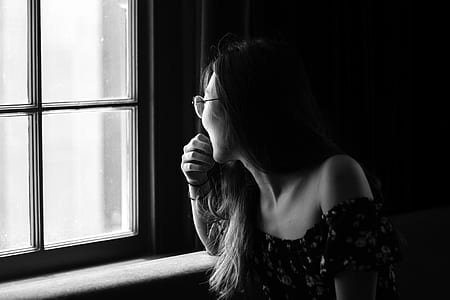 woman staring on window thumbnail