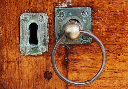 grey metal door knocker close-up photo thumbnail