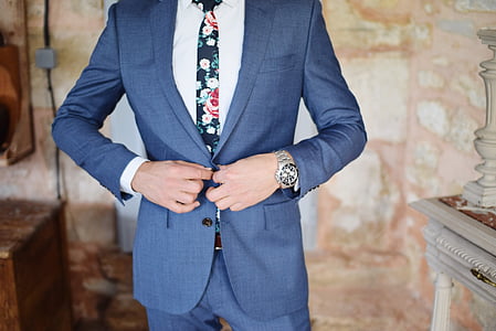 man wearing blue notched lapel suit jacket thumbnail