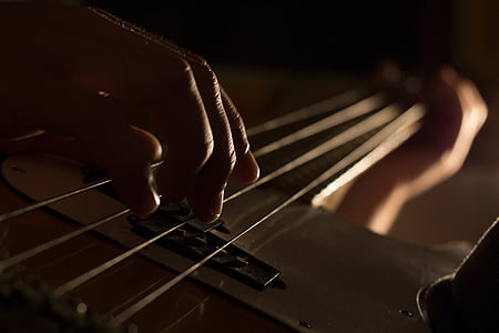 person using bass guitar thumbnail