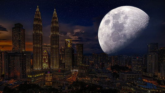 aerial photography of city buildings with moon overlay digital art thumbnail