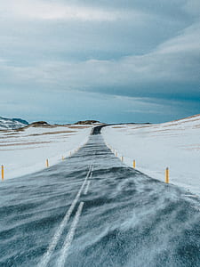 road street covered snow during daytime thumbnail