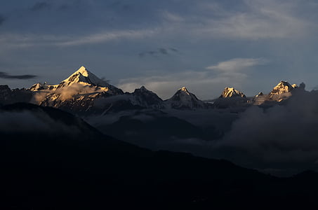 snow covered mountain during daytime thumbnail