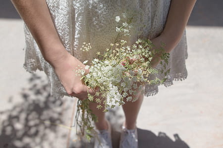 girl holding white flowers thumbnail