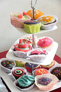 assorted-color cupcake on 3-tier stand rack thumbnail