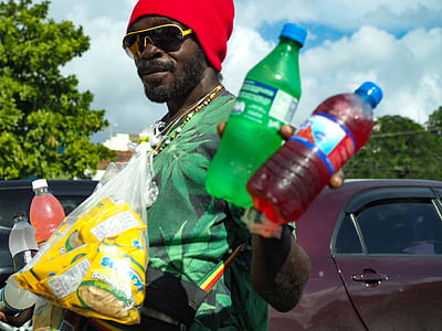 man holding plastic bottles thumbnail