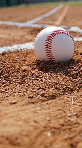 white baseball on field thumbnail
