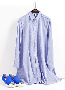 white and blue striped long-sleeved dress beside pair of blue shoes thumbnail