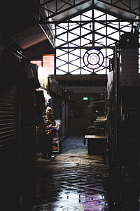 woman standing near store at daytime thumbnail