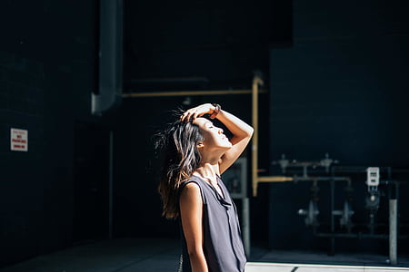 person in black sleeveless top standing thumbnail