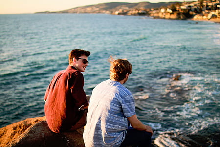 two man sitting on rocks thumbnail