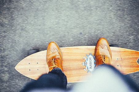 person standing on longboard thumbnail