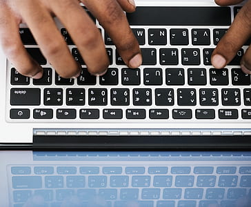 person using MacBook keyboard thumbnail