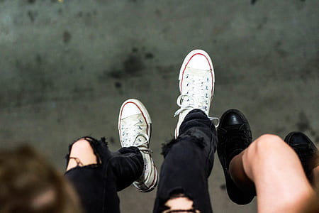 person wearing white low-top sneakers thumbnail