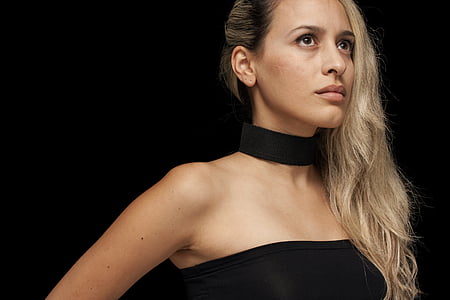 brown haired woman wearing black chocker and strapless top thumbnail