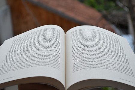 selective focus photography of book opened thumbnail