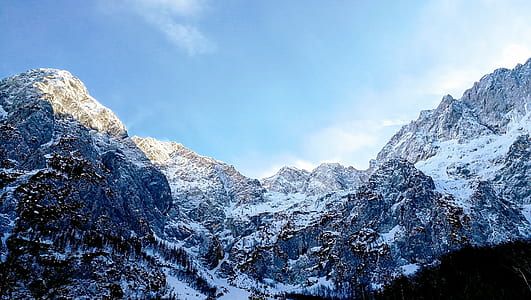 snow covered mountain under clear blue sky thumbnail