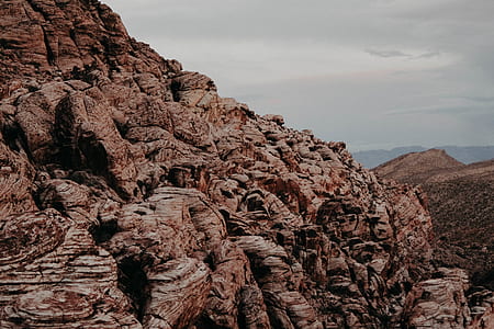 brown rock formation under white sky thumbnail