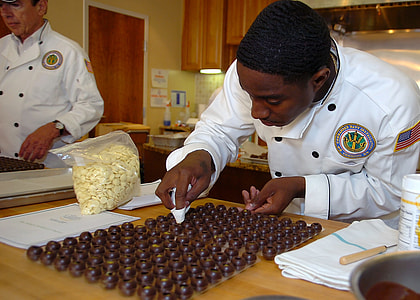 man wearing white chef suit while baking thumbnail