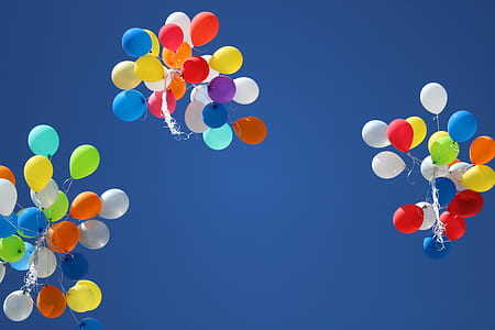 multicolored balloon floating during daytime thumbnail