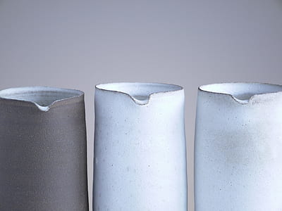 gray and two white pitchers thumbnail