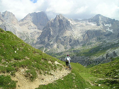 man carrying bicycle during daytime thumbnail