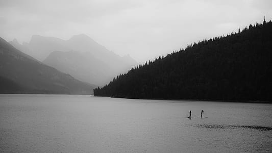 landscape photography of body of water near mountains thumbnail