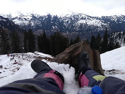 Person Wearing Black Boots At Snowy Mountain thumbnail