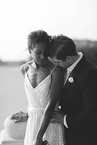couple wearing wedding dress and coat thumbnail