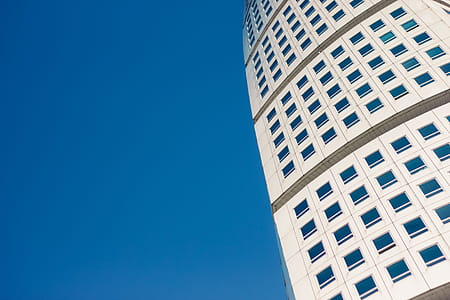Twisted exterior of Turning Torso, Malmo, Sweden with blue sky in the background thumbnail
