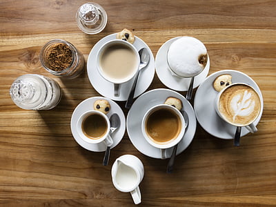 flat-lay photography of latte, pitcher, and jars thumbnail