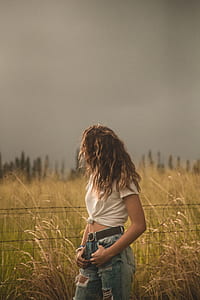 woman near gray steel fence thumbnail