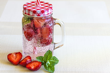 Mason jar of cold strawberry infused drink thumbnail