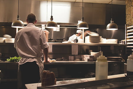 man in chef uniform standing near counter thumbnail
