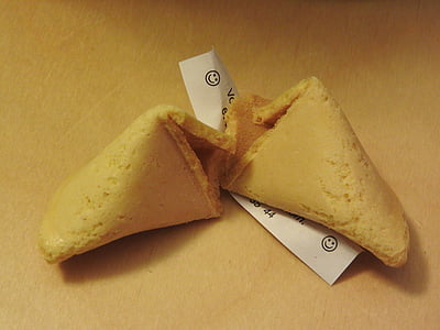 two fortune cookies on brown surface thumbnail