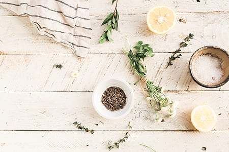 herbs near white ceramic bowl thumbnail