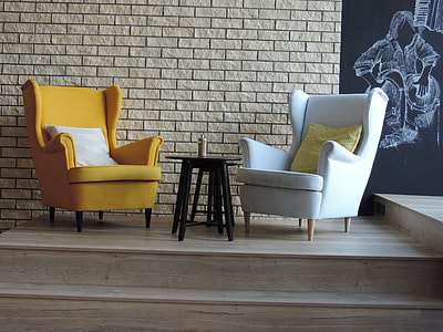 two white and yellow wingback chairs thumbnail