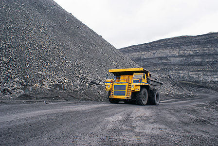 yellow and black heavy equipment on road thumbnail