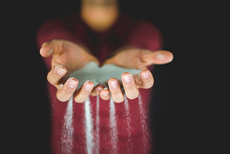 person holding sand thumbnail