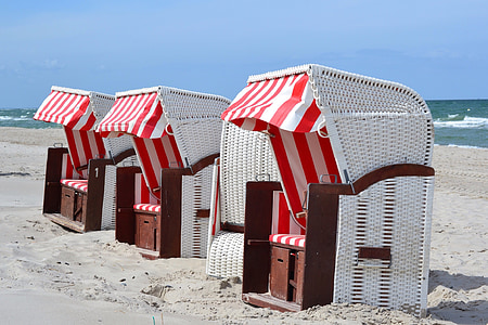 three white chairs on seashore thumbnail