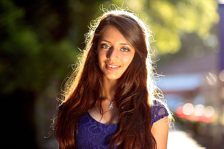 woman wearing blue lace top thumbnail