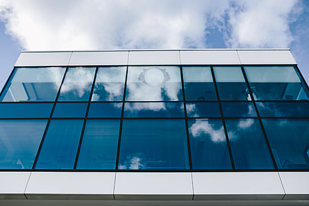 Office building windows and blue sky thumbnail