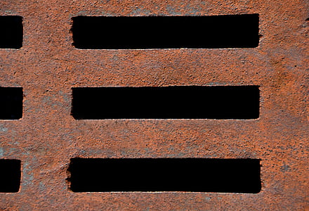close-up photo of brown metal drainage thumbnail