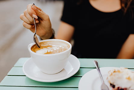 Drinking coffee and eating cake in a cafeteria thumbnail