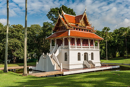 brown and white house near trees thumbnail
