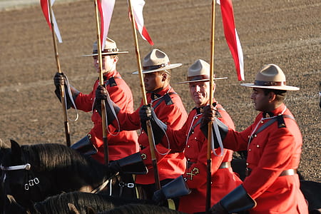 four soldiers on horseback carrying red flags thumbnail