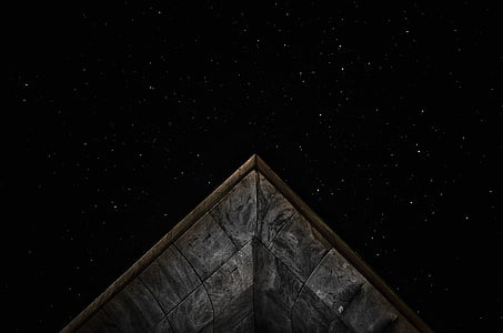 view of stars over the concrete building during night thumbnail